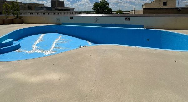 Restored rooftop pool with new blue epoxy coating at Dayton apartment community