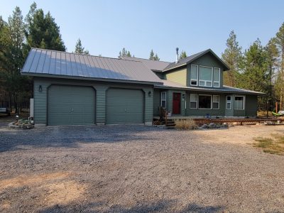 Repainted home exterior and garage in La Pine, Oregon