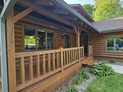stained log home and front porch