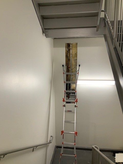 ladder in stairwell with drywall removed Preview Image 4