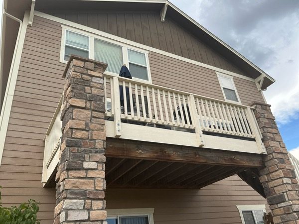 Before exterior color change showing the rear deck and side exterior of a Castle Rock home Preview Image 6