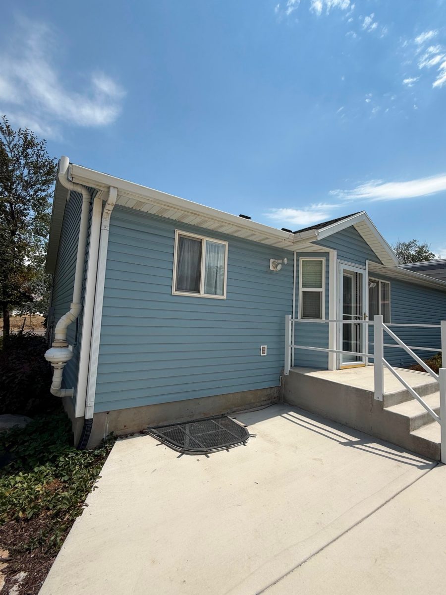 House exterior with painted blue siding and white trim Preview Image 4