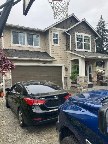 house with tan and brown siding and garage door Preview Image 1