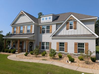 APPLIED SOLID STAIN TO NEW WOOD SHUTTERS AND PORCH COLUMNS