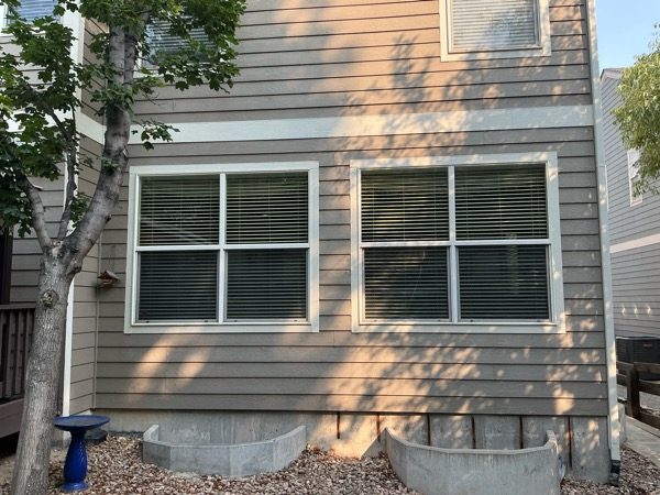 tan house siding and white trim before repaint Preview Image 7