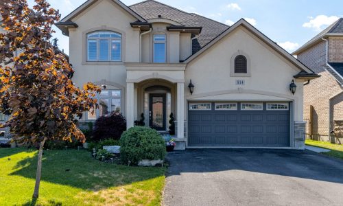 Two-Story Warm Cream Stucco & Architectural Trim Exterior Painting