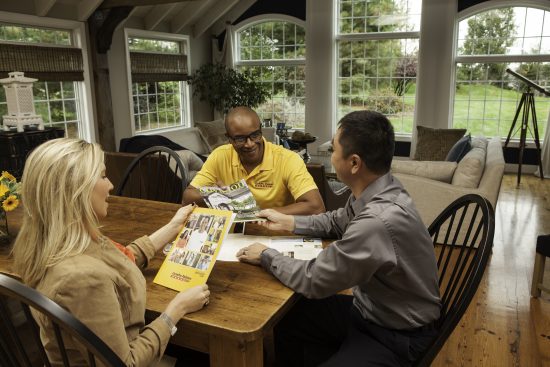 CertaPro Team Member giving a color consultation to a couple