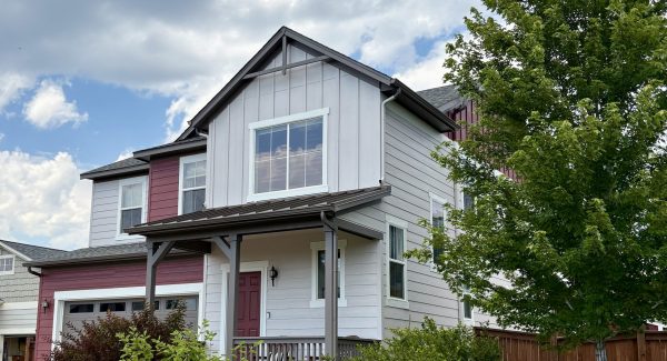 front of house with painted red and soft grey siding