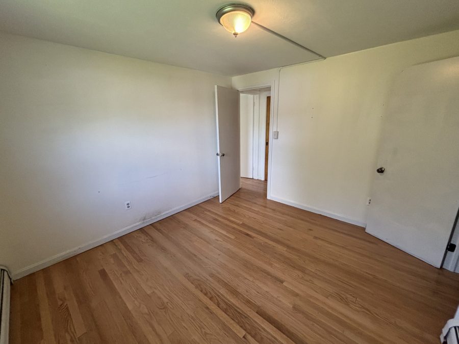 interior room in house with wooden floors and dirty and worn paint on walls Preview Image 14