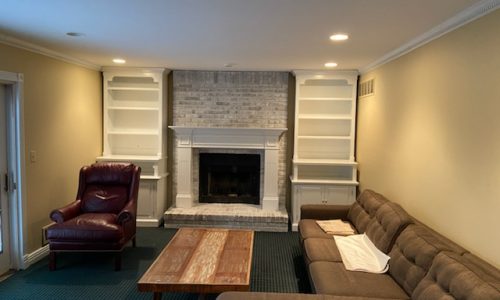 Whitewashed Brick Fireplace and Built-In Bookshelf Painting