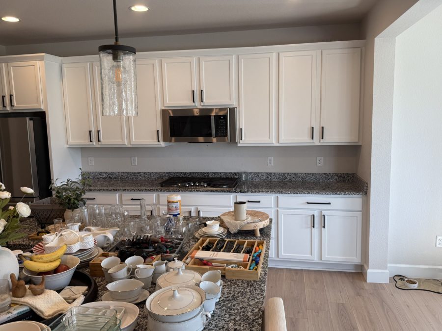 white painted kitchen cabinets with black hardware after repaint Preview Image 2