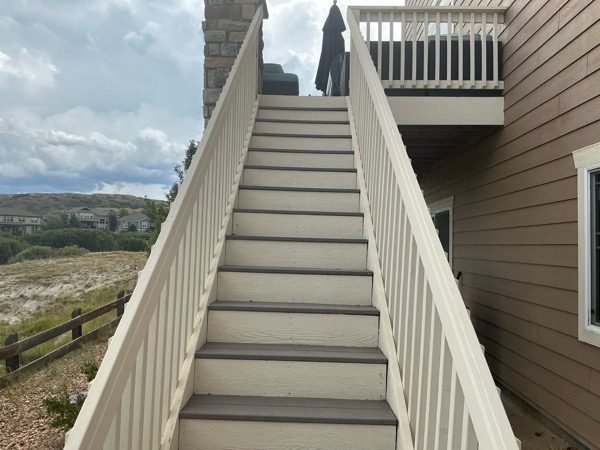 After exterior color change showing the rear deck steps and handrails of a Castle Rock home Preview Image 7