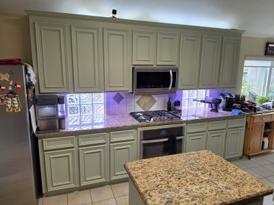 home kitchen with soft green painted cabinets