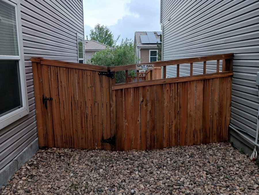 stained fence surrounding home and yard Preview Image 4