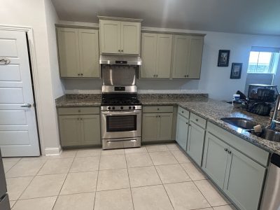 sage green painted kitchen cabinets