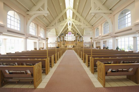 Interior view of a modern church with empty pews