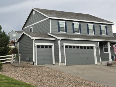 front of house with grey painted siding