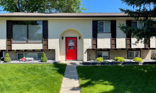 Exterior Stucco Coating and Bold Red Entry Door