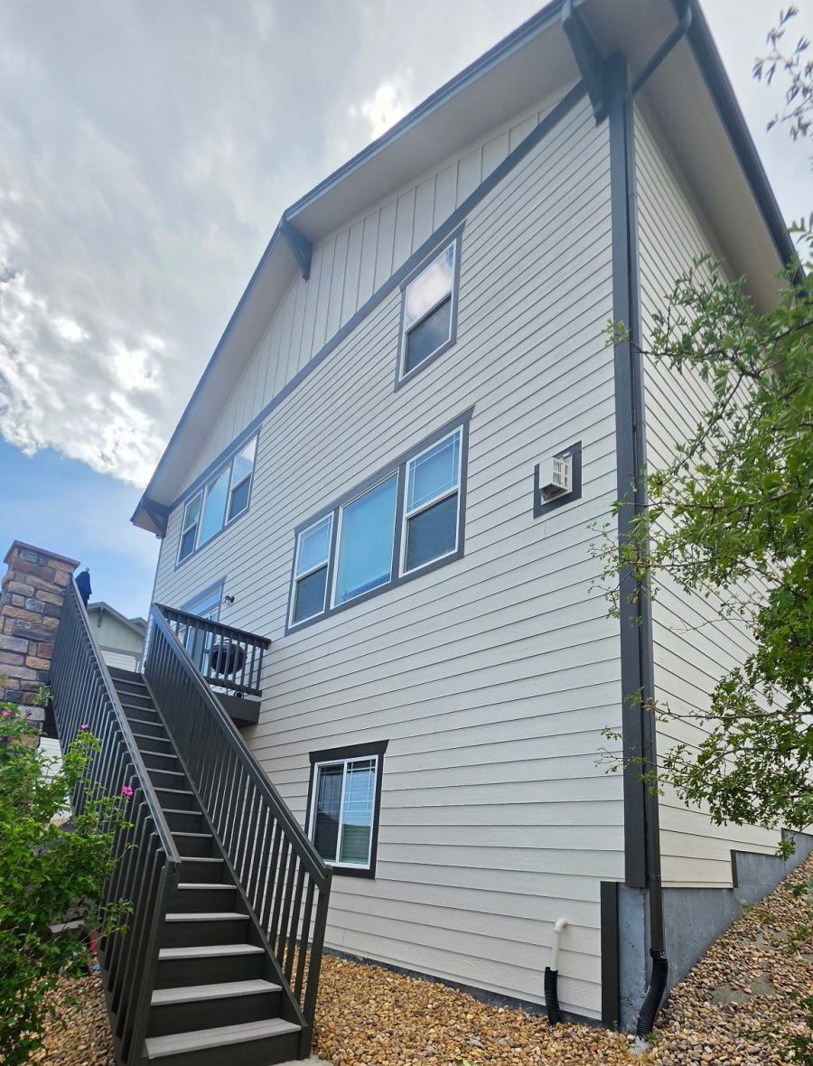 After exterior color change showing the rear exterior, stairs, and downspout of a Castle Rock home Preview Image 2
