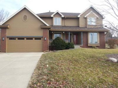 Exterior house painting by CertaPro painters in West Omaha, NE