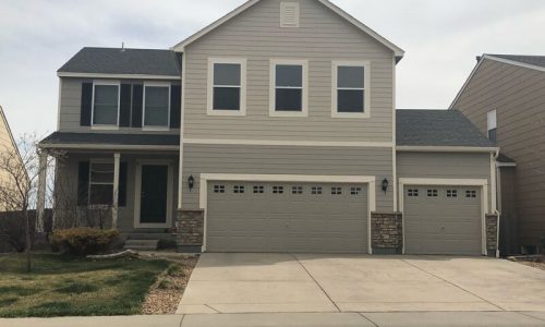 Greige Exterior Transformation with Black Shutters