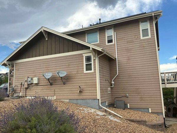 Before exterior paint color change, rear deck and lower rear exterior of a Castle Rock home in Castle Rock, CO Preview Image 8