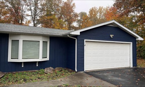 Navy Lap and Board-and-Batten Siding with Bright White Trim