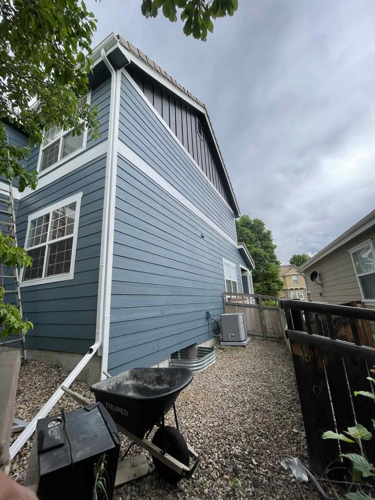 side of house with blue painted siding Preview Image 1
