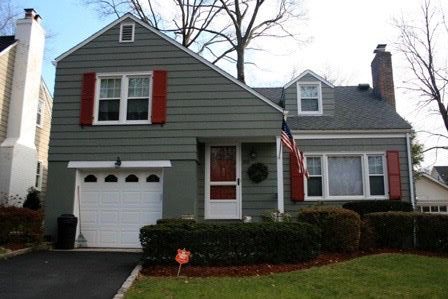 Olive Clapboards with Cranberry Red Shutters