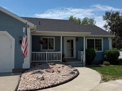 House exterior with painted blue siding and white trim