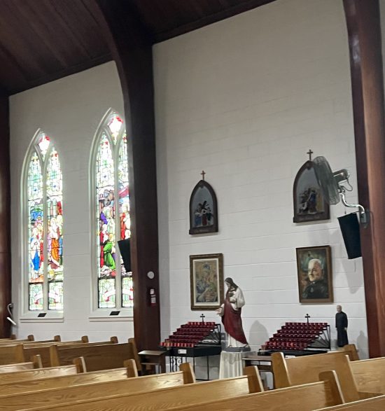 stained glass windows and pews in church