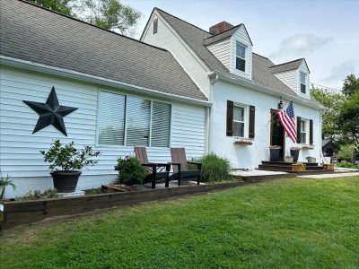 Painted white exterior of a residential home in Owings, MD