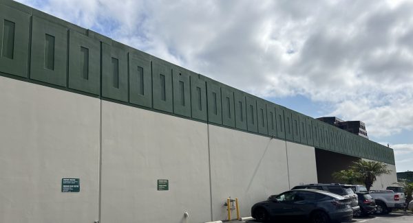 repainted factory exterior with green accent band