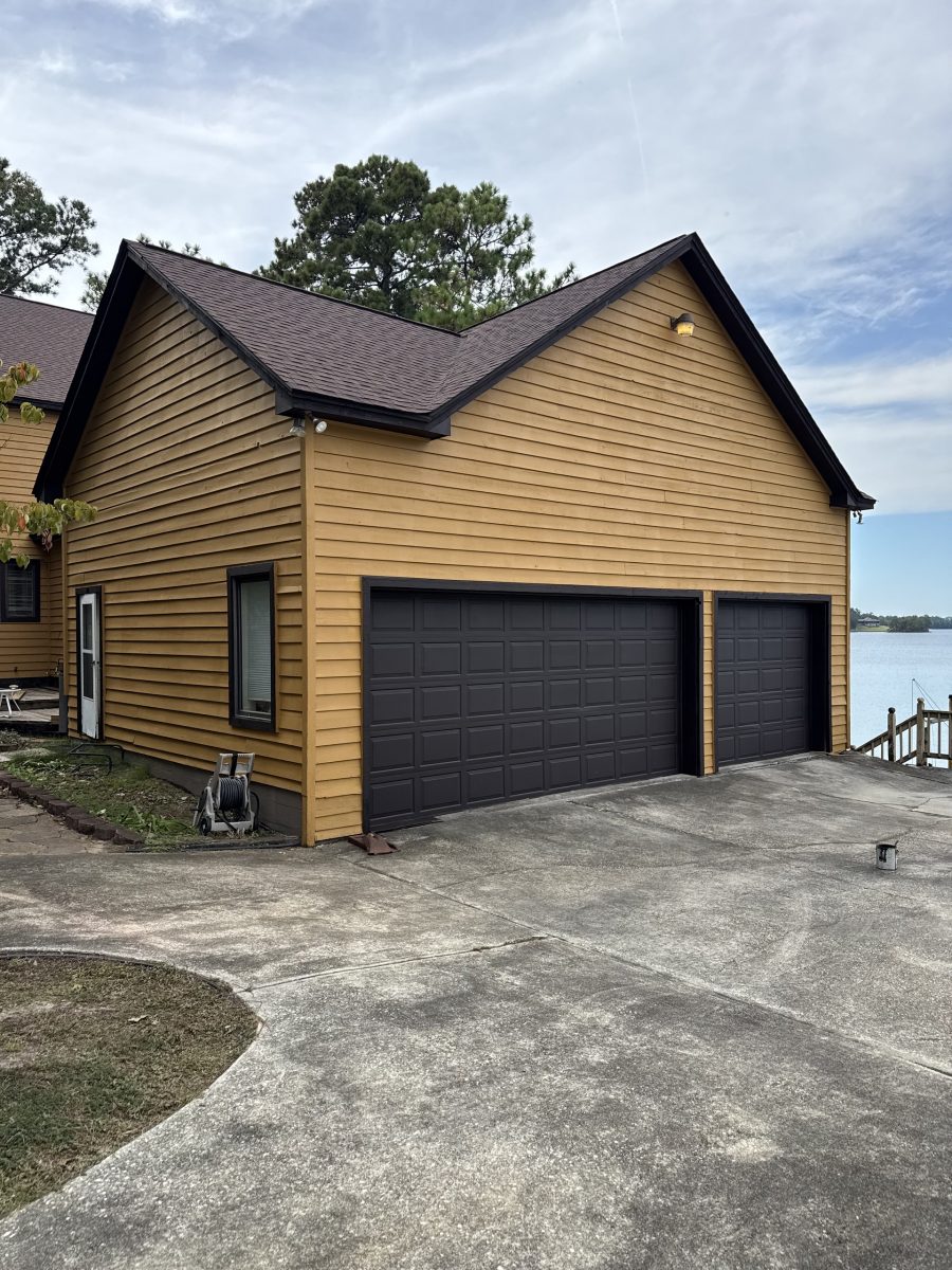 Right elevation of a Dadeville lake house after exterior painting with updated siding and dark trim Preview Image 3