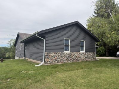 grey stained cedar siding on house exterior