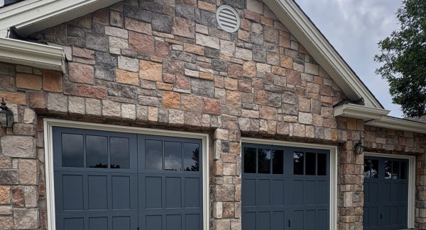 blue painted 3 car garage doors