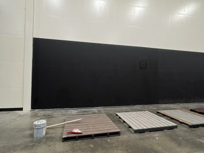 black painted wall in TireHub warehouse