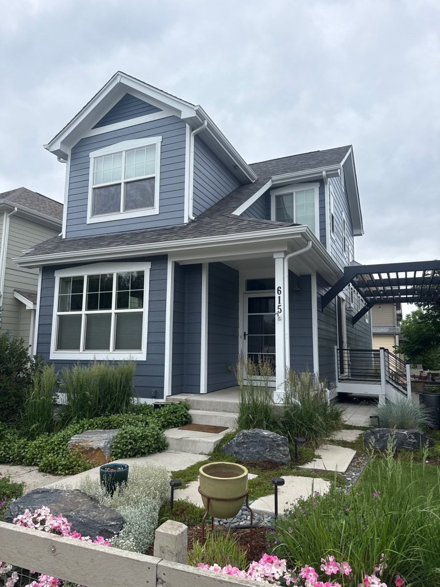 front of house with blue-grey siding and attached pergola Preview Image 2