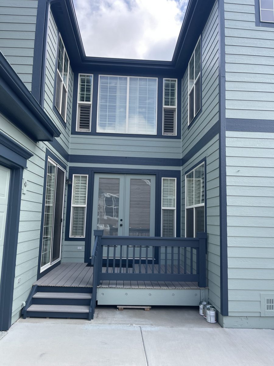 painted house exterior with light seafoam green siding and navy trim Preview Image 4