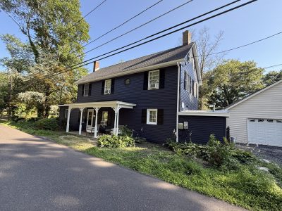 deep blue siding with white and black trim