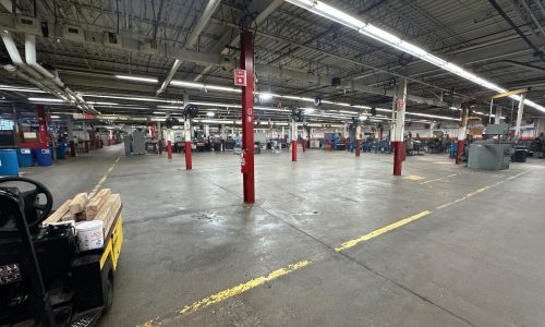 Worn Safety Markings Across Manufacturing Floor