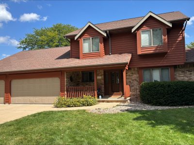 front of house with painted cedar siding