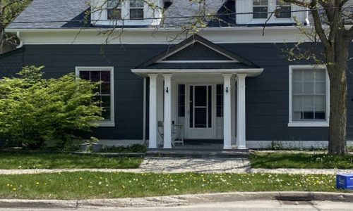 Full Exterior Navy Siding, Front Porch, and Fish-Scale Gable Painting