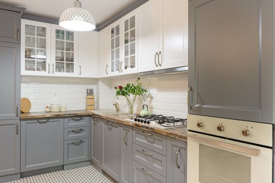 Freshly Painted Grey and White Kitchen Cabinets