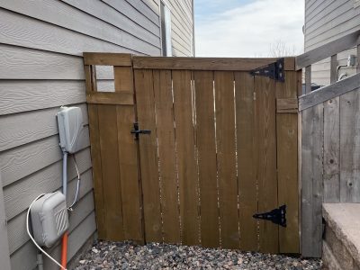stained wooden fence gate