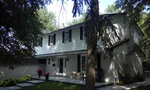 Two-Story White Siding & Painted Brick Exterior Repaint