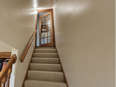 Ceiling and wall painting in basement with stairwell