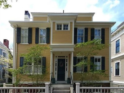 yellow painted historical home exterior