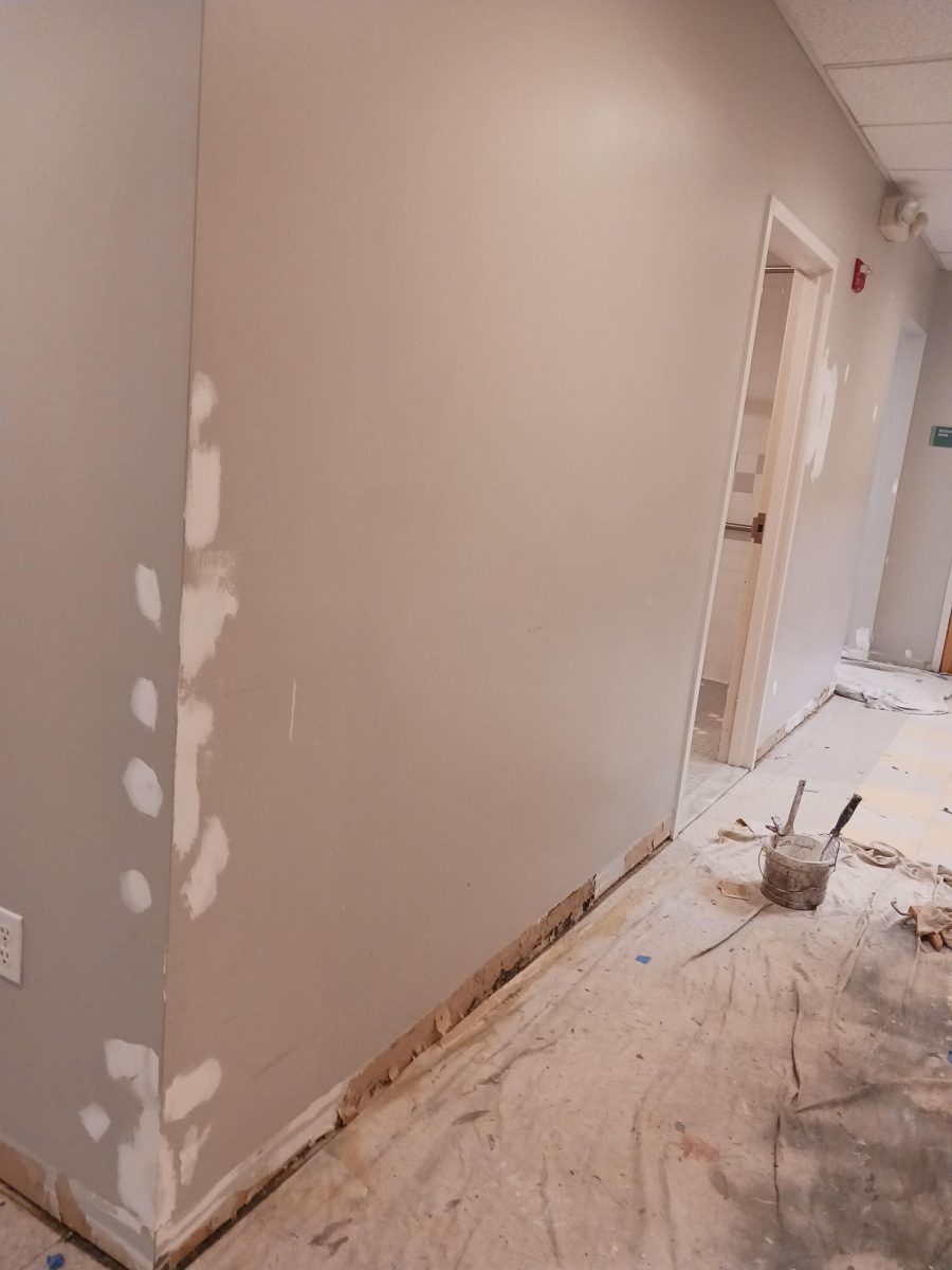 fixing drywall in a hallway at charles river center prior to painting Preview Image 5