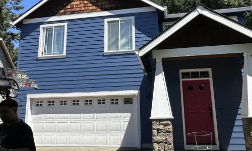 Deep Navy Siding and White Portico Paint Job